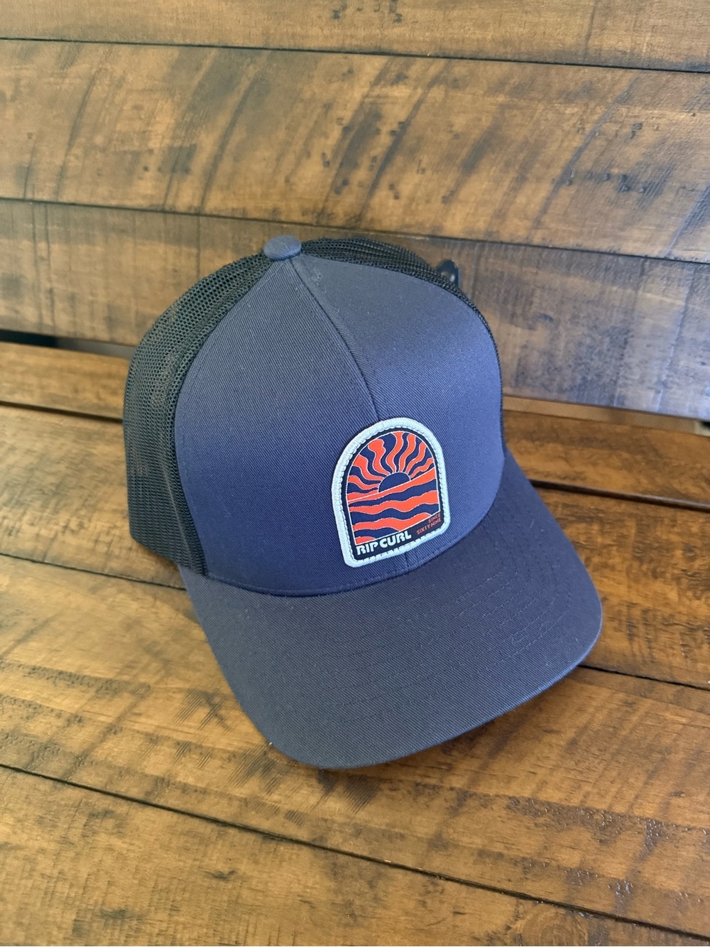 Rip Curl Navy & Black Trucker Hat with Red-Orange Patch